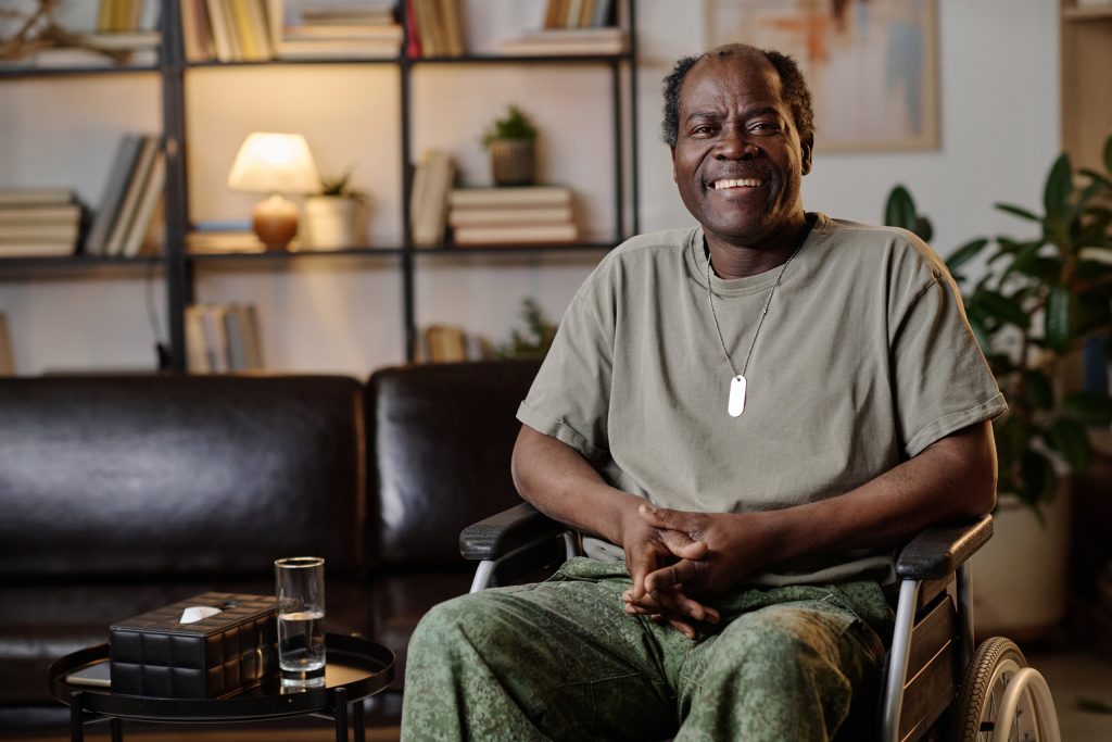 senior african american soldier in wheelchair sitting at psychologist office